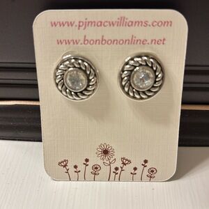 Round earrings with diamond like features. Brand new.